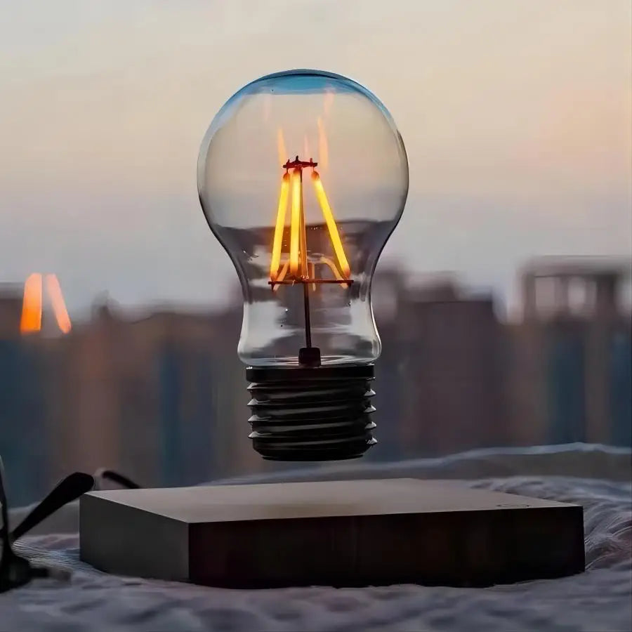 Levitating bulb with glowing filament against a blurred cityscape background