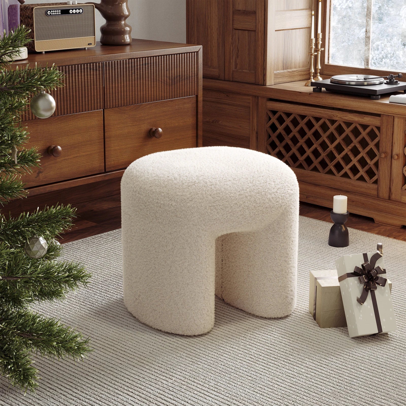 Beige ottoman in a room with wooden furniture and a Christmas tree.