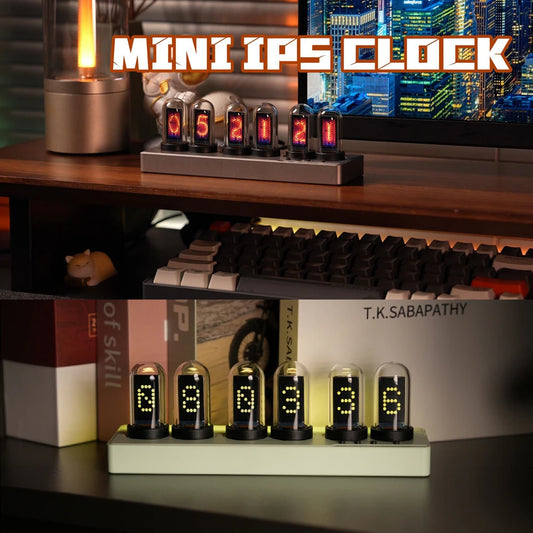 Digital clock with LED display on a desk with books and a keyboard in the background.