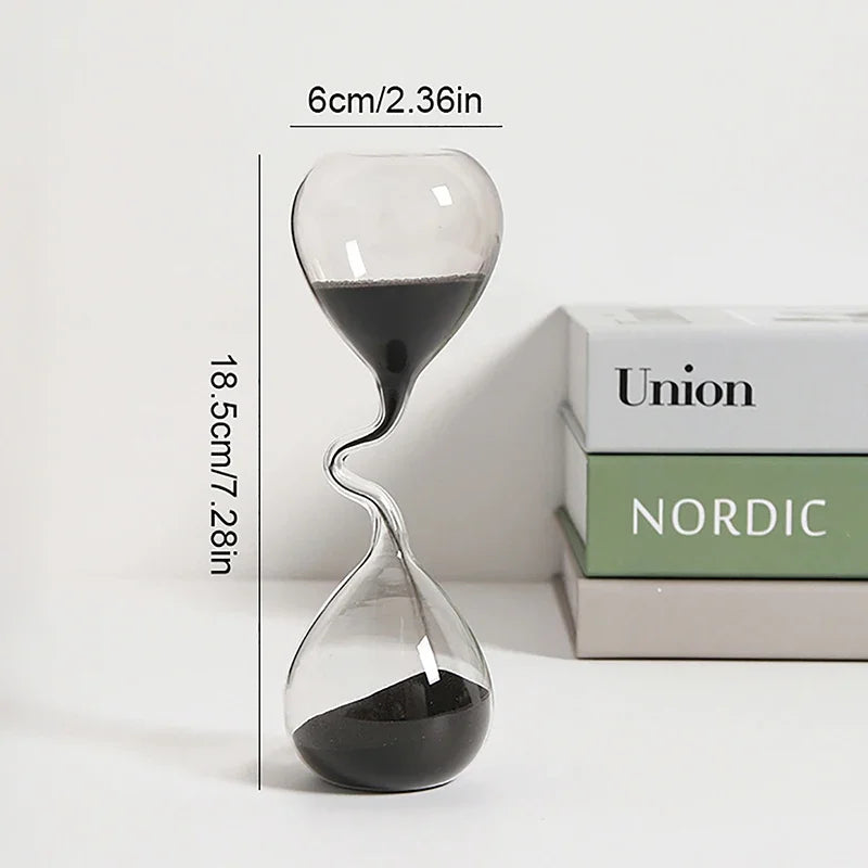 Glass hourglass with measurements on a white background