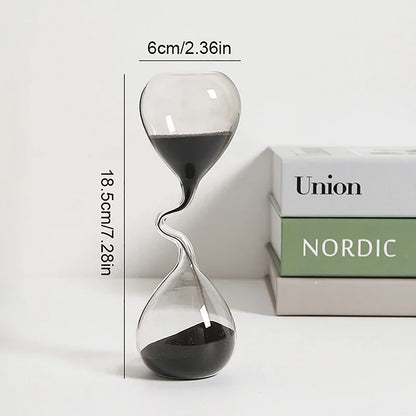 Glass hourglass with measurements on a white background